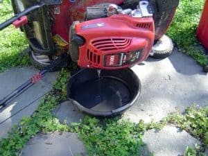 3. Turn the Mower On Its Side Then Drain The Fuel Tank 