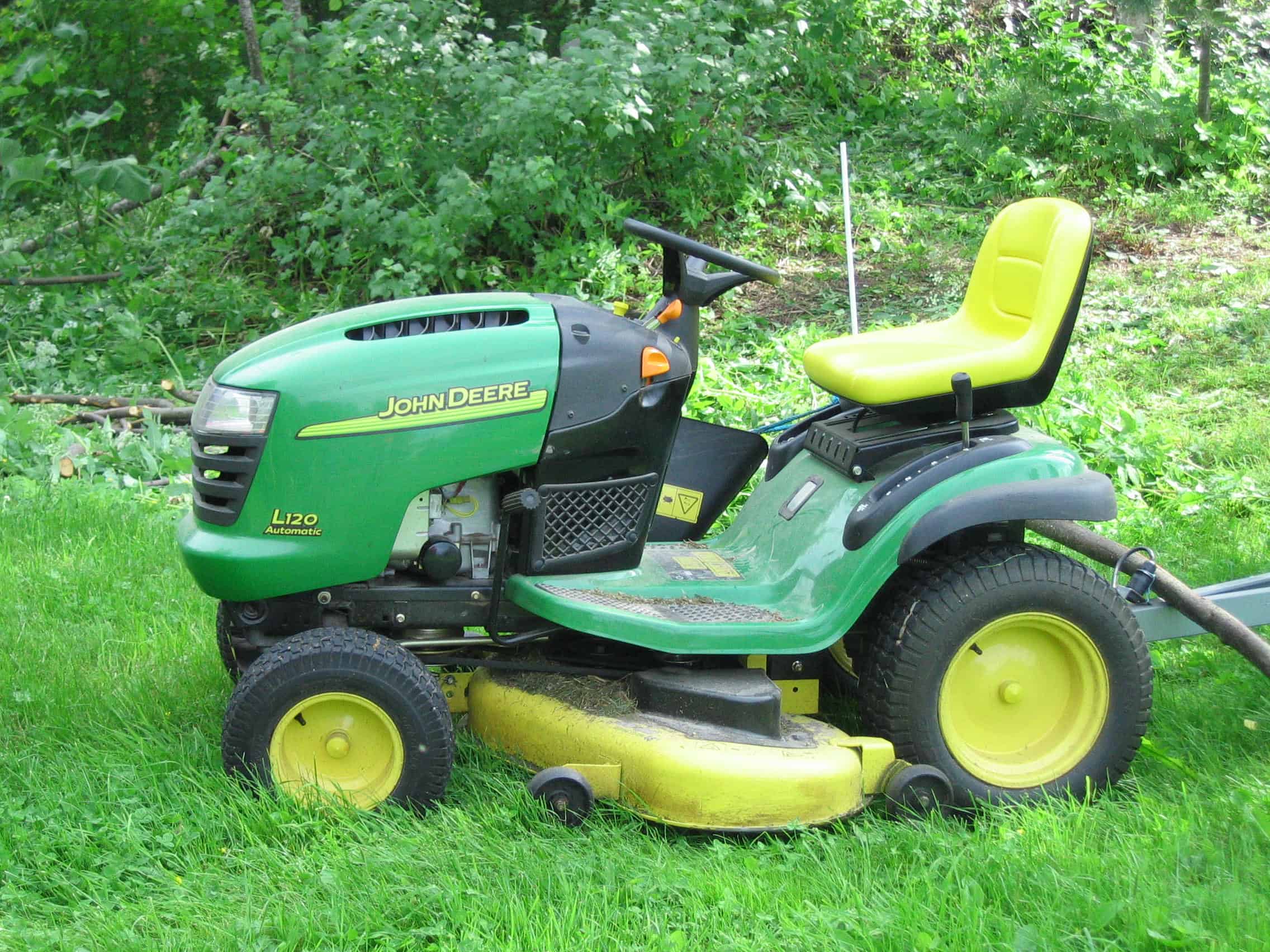 john deere l120 with problems tractor on green lawn
