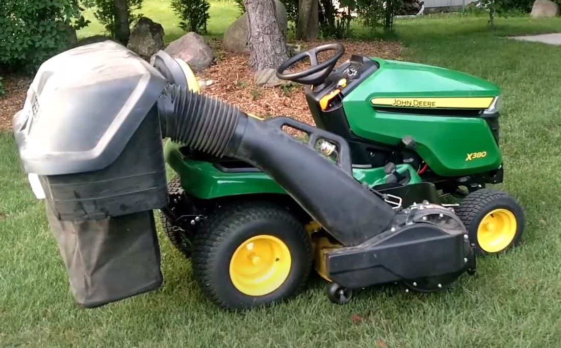 john deere x380 with problems tractor on green lawn with a tree behind