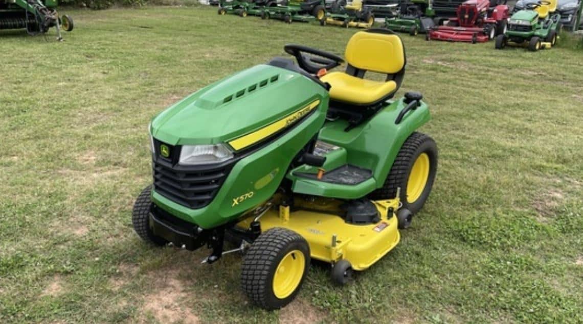 john deere x570 parked on grass used lawn tractor with problems